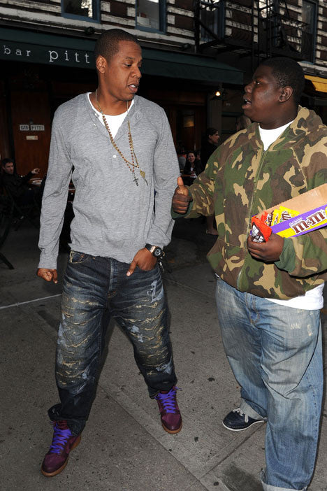 Jay-Z in a pair of destroyed jeans